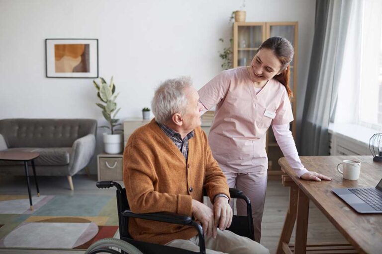 A middle-aged woman warmly greeting her elderly loved one in a comfortable assisted living lounge.