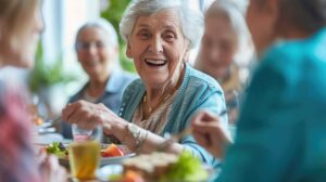 Older adults play cards and work on a puzzle together at a bright assisted living activity table.